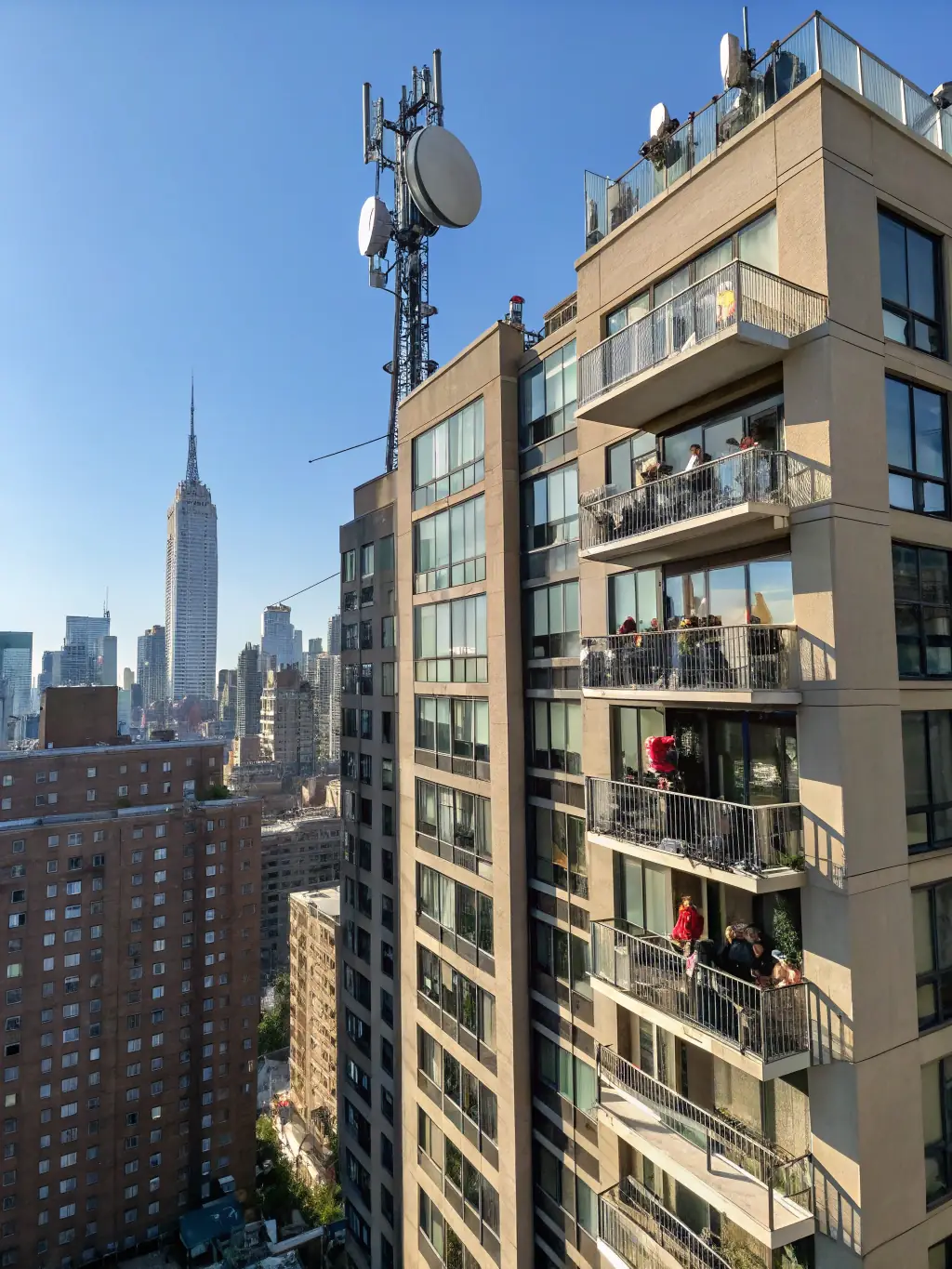 A high-quality photo of a 5G fixed wireless access terminal installed on a rooftop, showcasing its sleek design and connectivity capabilities in a modern urban setting.